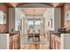Elegant dining room with hardwood floors, a large table, and a stylish chandelier in neutral tones at 2714 Calmante Pl, Superior, CO 80027