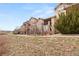 Beautifully landscaped townhomes with stone accents and private balconies at 2714 Calmante Pl, Superior, CO 80027