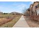 Picturesque walkway lined with lush landscaping, offering a serene and inviting outdoor space at 2714 Calmante Pl, Superior, CO 80027