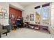 Spacious carpeted office with large windows, built-in shelving, and ample workspace for two at 2714 Calmante Pl, Superior, CO 80027