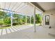 Relaxing back patio offers a serene outdoor retreat with a pergola and views of the lush greenery at 7472 Iridium Way, Castle Rock, CO 80108