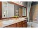 Bathroom featuring double sinks, tile floors, and a shower and bath combo at 7472 Iridium Way, Castle Rock, CO 80108