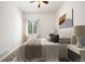 Bedroom with light walls, neutral carpet, one window, and coordinated decor at 7472 Iridium Way, Castle Rock, CO 80108