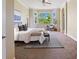 Spacious bedroom with neutral colors and floor to ceiling windows with wooded view at 7472 Iridium Way, Castle Rock, CO 80108