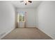 Image of a bedroom with light walls, neutral carpet, and a single window at 7472 Iridium Way, Castle Rock, CO 80108
