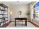 Bright home office featuring a sleek desk, shelving, and natural light at 7472 Iridium Way, Castle Rock, CO 80108