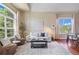 Comfortable living room with stylish decor, hardwood floors and plenty of natural light at 7472 Iridium Way, Castle Rock, CO 80108