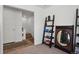 Bright room featuring a doorway, carpet, and shelving at 5121 N Yampa St, Denver, CO 80249
