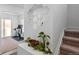 Hallway featuring a staircase, a decorative mirror, and carpet at 5121 N Yampa St, Denver, CO 80249