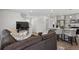 Open concept living room and kitchen area boasts bright modern features and contemporary design elements at 5121 N Yampa St, Denver, CO 80249
