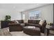 Spacious living room with large sectional sofa, carpet and modern decor at 5121 N Yampa St, Denver, CO 80249