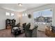 Upstairs sitting area offering an inviting space with comfortable seating, great natural light and modern accents at 5121 N Yampa St, Denver, CO 80249