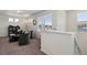 Inviting upstairs sitting area featuring plush chairs, plenty of natural light, and a cozy atmosphere at 5121 N Yampa St, Denver, CO 80249