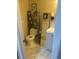 Cozy bathroom featuring a toilet with storage shelves and a vanity with a large mirror at 8452 Everett Way # C, Arvada, CO 80005