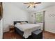 Spacious bedroom boasts wood floors, and a sunny window with peaceful green tree views at 8452 Everett Way # C, Arvada, CO 80005