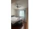 Cozy bedroom featuring hardwood floors, a ceiling fan, and a sunlit window at 8452 Everett Way # C, Arvada, CO 80005