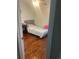 Bright bedroom with hardwood floors, and a plush gray bed frame at 8452 Everett Way # C, Arvada, CO 80005