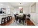 Dining area with a chandelier and counter seating, open to the kitchen at 8452 Everett Way # C, Arvada, CO 80005