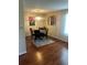 Dining room with hardwood floors, a chandelier, and seating for four at the dining table at 8452 Everett Way # C, Arvada, CO 80005