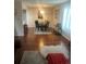 Charming dining area featuring hardwood floors, a modern light fixture, and an open layout at 8452 Everett Way # C, Arvada, CO 80005
