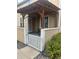 Charming front porch with a pergola and a white gate for added privacy and curb appeal at 8452 Everett Way # C, Arvada, CO 80005