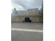 Townhome featuring an attached garage with multiple bays and ample parking space at 8452 Everett Way # C, Arvada, CO 80005