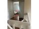 Hallway view into a bedroom with hardwood floors and closet doors at 8452 Everett Way # C, Arvada, CO 80005