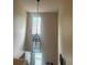 Hallway featuring a hanging light fixture and natural light from a window at 8452 Everett Way # C, Arvada, CO 80005