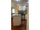 Well-lit kitchen with white cabinets, stainless steel appliances, and granite countertops at 8452 Everett Way # C, Arvada, CO 80005