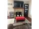 Inviting living room features a stone fireplace and decorative shelving, perfect for relaxation at 8452 Everett Way # C, Arvada, CO 80005