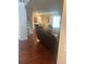Inviting living room with hardwood floors, neutral paint, and views to the dining area at 8452 Everett Way # C, Arvada, CO 80005