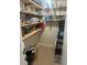 Walk-in pantry with abundant shelving, tiled flooring, and organized storage at 8452 Everett Way # C, Arvada, CO 80005