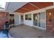 Covered back patio with sliding glass doors leading to the interior at 1456 S Moline St, Aurora, CO 80012