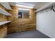 Finished basement closet with wood-paneled walls and ample shelving at 1456 S Moline St, Aurora, CO 80012