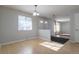 Bright dining area with hardwood floors and view into living room at 1456 S Moline St, Aurora, CO 80012