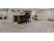 Basement with bar area, seating, workout bike and additional open area at 16120 E 119Th Ave, Commerce City, CO 80022