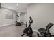 Basement gym area featuring elliptical and stationary bike on neutral carpet at 16120 E 119Th Ave, Commerce City, CO 80022