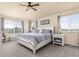 Comfortable bedroom featuring ample natural light and stylish furnishings at 16120 E 119Th Ave, Commerce City, CO 80022