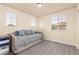 Cozy bedroom filled with natural light from windows, featuring a daybed with a comfy mattress at 16120 E 119Th Ave, Commerce City, CO 80022