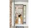 Bright and airy foyer with hardwood floors and a staircase leading to the second floor at 16120 E 119Th Ave, Commerce City, CO 80022