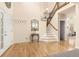 Grand foyer features hardwood floors, staircase, and ample natural light at 16120 E 119Th Ave, Commerce City, CO 80022