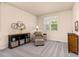 Cozy sitting room filled with natural light, neutral colors and comfortable furnishings at 16120 E 119Th Ave, Commerce City, CO 80022