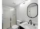 Bathroom features a modern sink, toilet, and enclosed shower with sliding glass doors at 1874 Cedaridge Cir, Superior, CO 80027