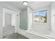 Bathroom featuring a tub, glass enclosed shower, and white cabinets at 1874 Cedaridge Cir, Superior, CO 80027