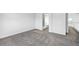Bedroom view with gray carpeting leading to an upstairs bathroom and landing at 1874 Cedaridge Cir, Superior, CO 80027