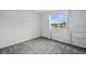 Bedroom with a window providing natural light and shelving for storage at 1874 Cedaridge Cir, Superior, CO 80027