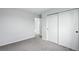 Bedroom showcasing a large closet and access to the upper level at 1874 Cedaridge Cir, Superior, CO 80027