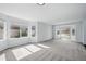Spacious living room featuring large windows that illuminate the room with sunlight at 1874 Cedaridge Cir, Superior, CO 80027
