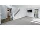 Inviting living room and staircase features neutral paint and plenty of natural light at 1874 Cedaridge Cir, Superior, CO 80027