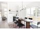 Contemporary dining area with a bar, a tile wall, and views of the backyard at 3530 Fenton St, Wheat Ridge, CO 80212